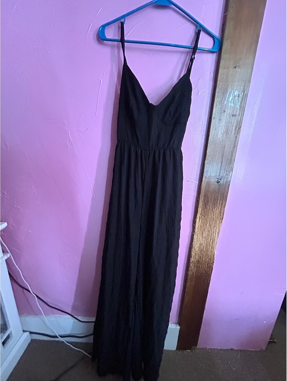 Elegant Black jumpsuit with V-Neck, Adjustable Spaghetti Straps, and Open Back